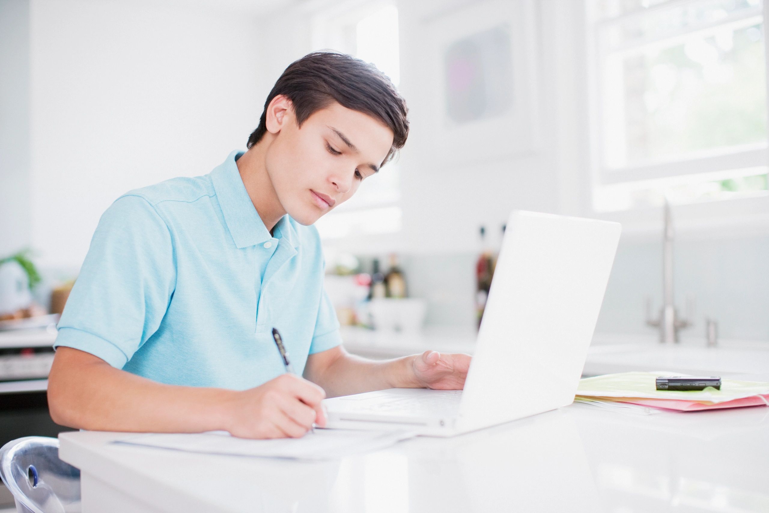 Student learning English remotely on a laptop