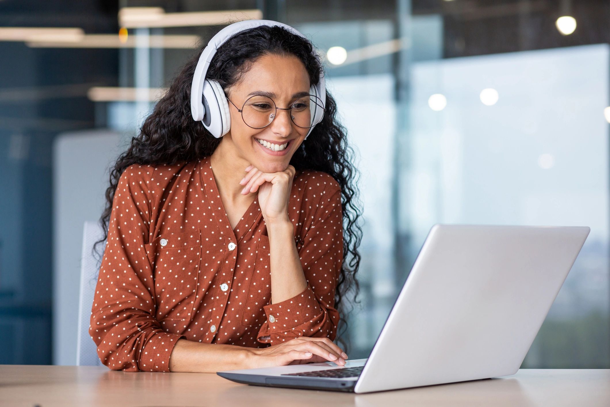 English learner using a laptop and headphones